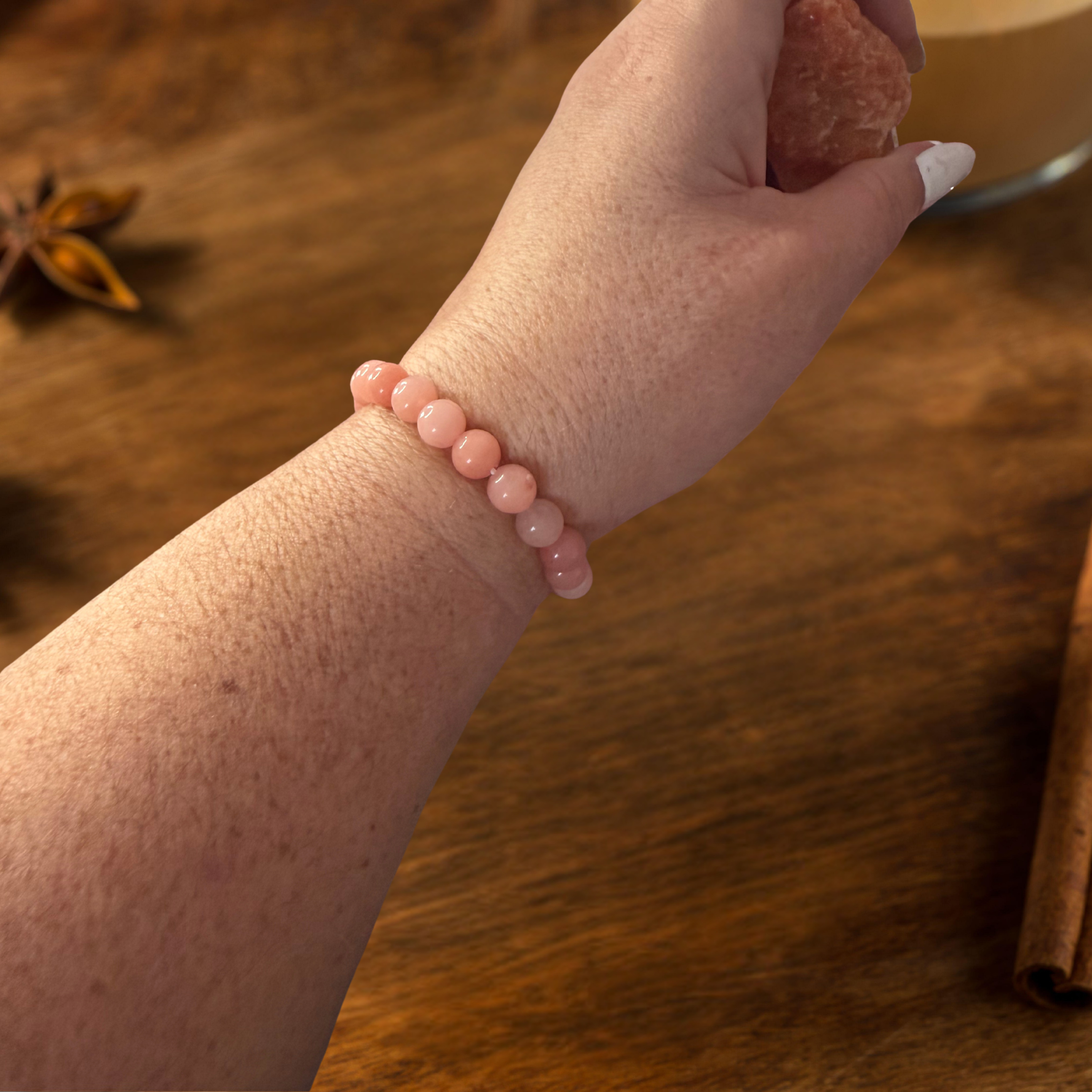Person wearing a sunstone bracelet from the Winter Mood Magic SAD & winter blues rescue kit, crystal jewellery to lift mood and boost winter energy.
